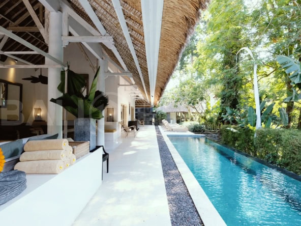 "Bali riverfront villa with private pool, spa room, and lush surroundings, offered on a 20+15 year lease."