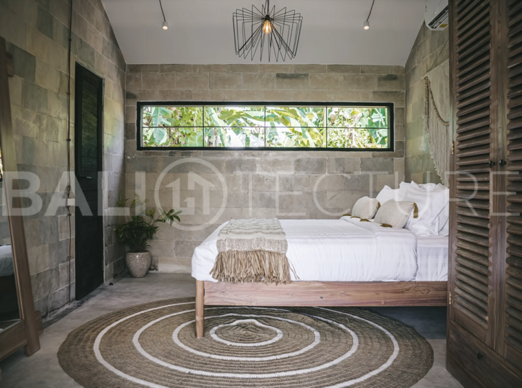 Comfortable bedroom with modern furnishings in a 4-bedroom Ubud villa.