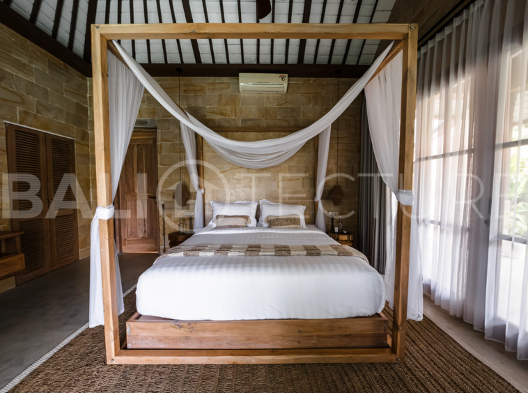 A modern 1-bedroom villa in Ubud, featuring a private pool surrounded by lush greenery and sleek contemporary design.