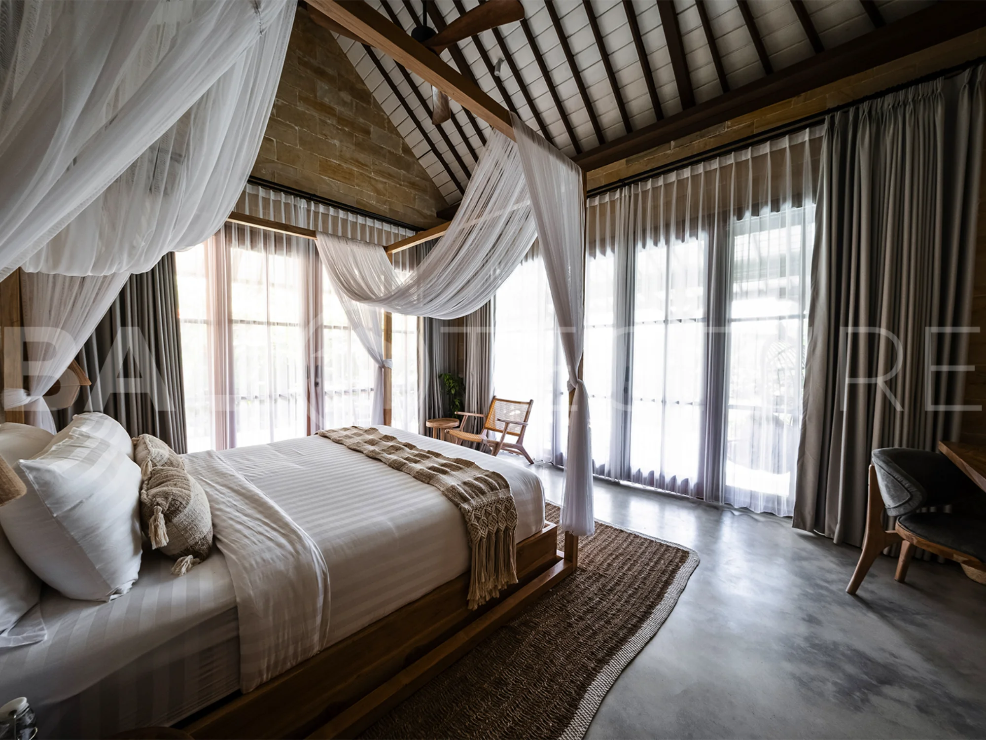 A modern 1-bedroom villa in Ubud, featuring a private pool surrounded by lush greenery and sleek contemporary design.