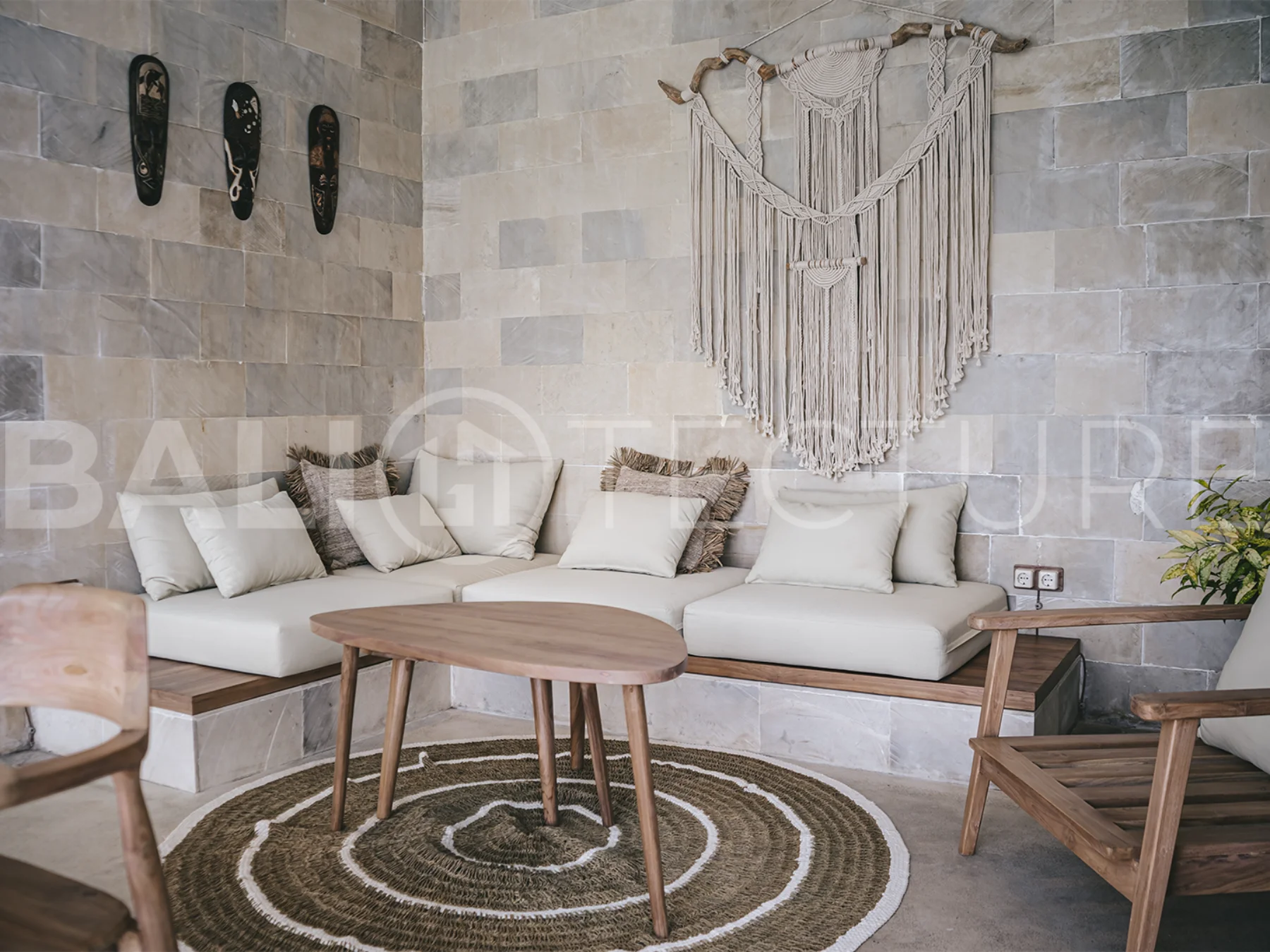 Spacious living area with stylish interiors and natural light in a luxury Ubud villa.