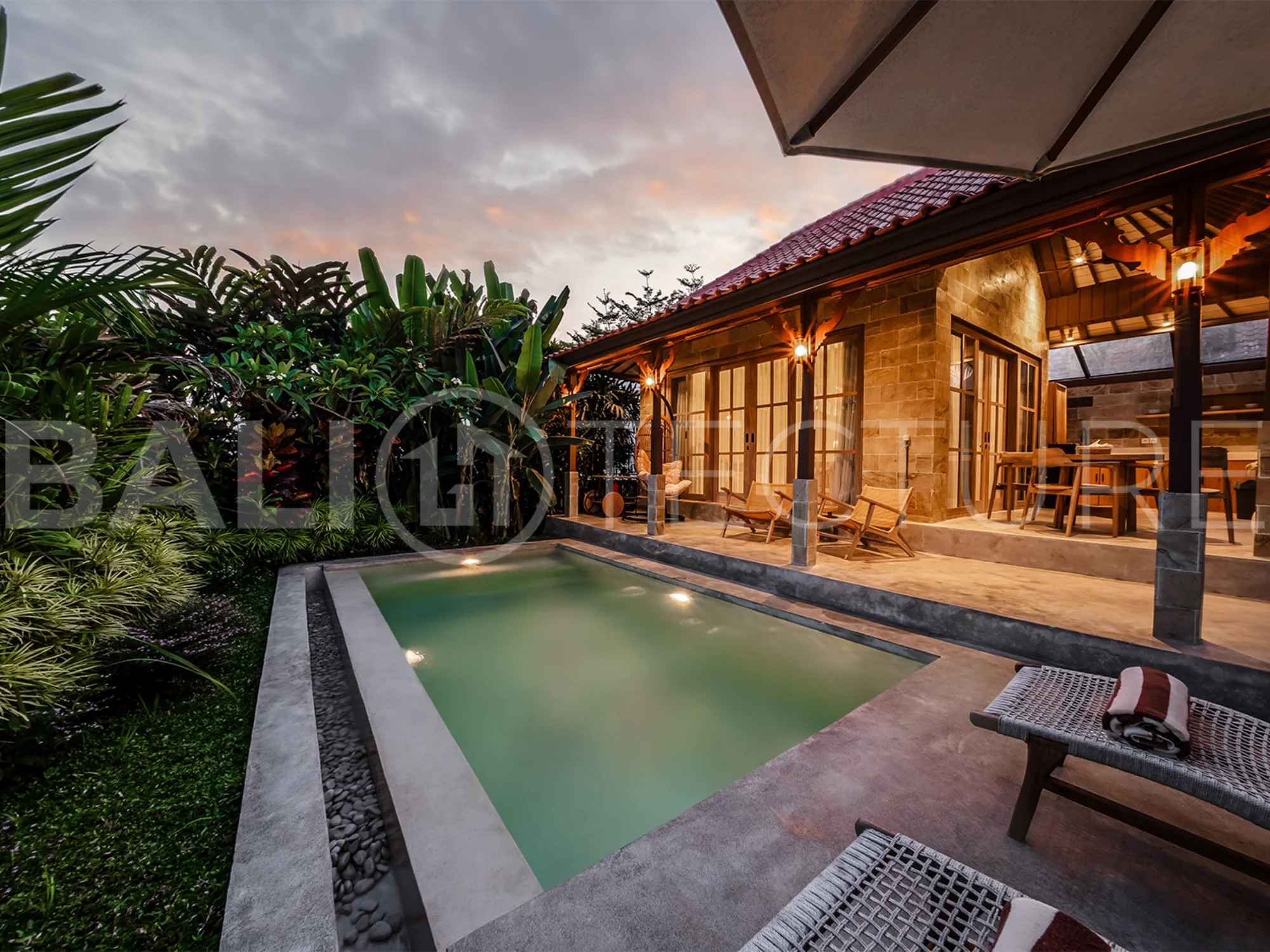 Interior view of the open-plan living area in a stylish Ubud villa, blending comfort and modern aesthetics.