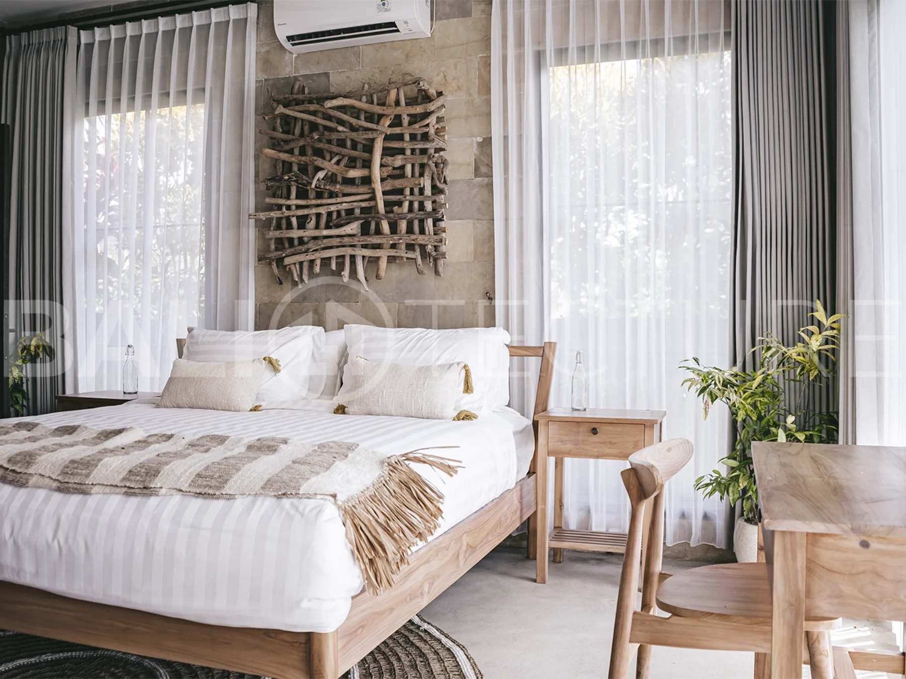 Elegant private pool surrounded by lush greenery in a tranquil Bali setting.