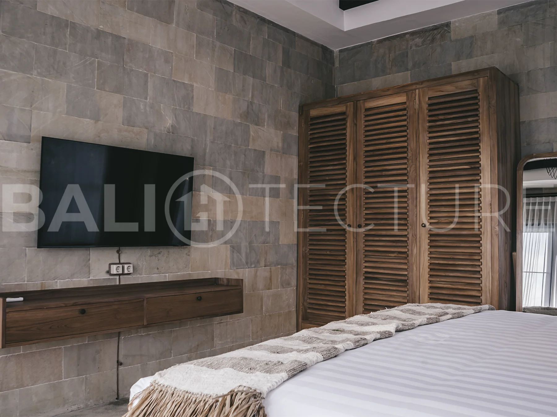 Elegant private pool surrounded by lush greenery in a tranquil Bali setting.