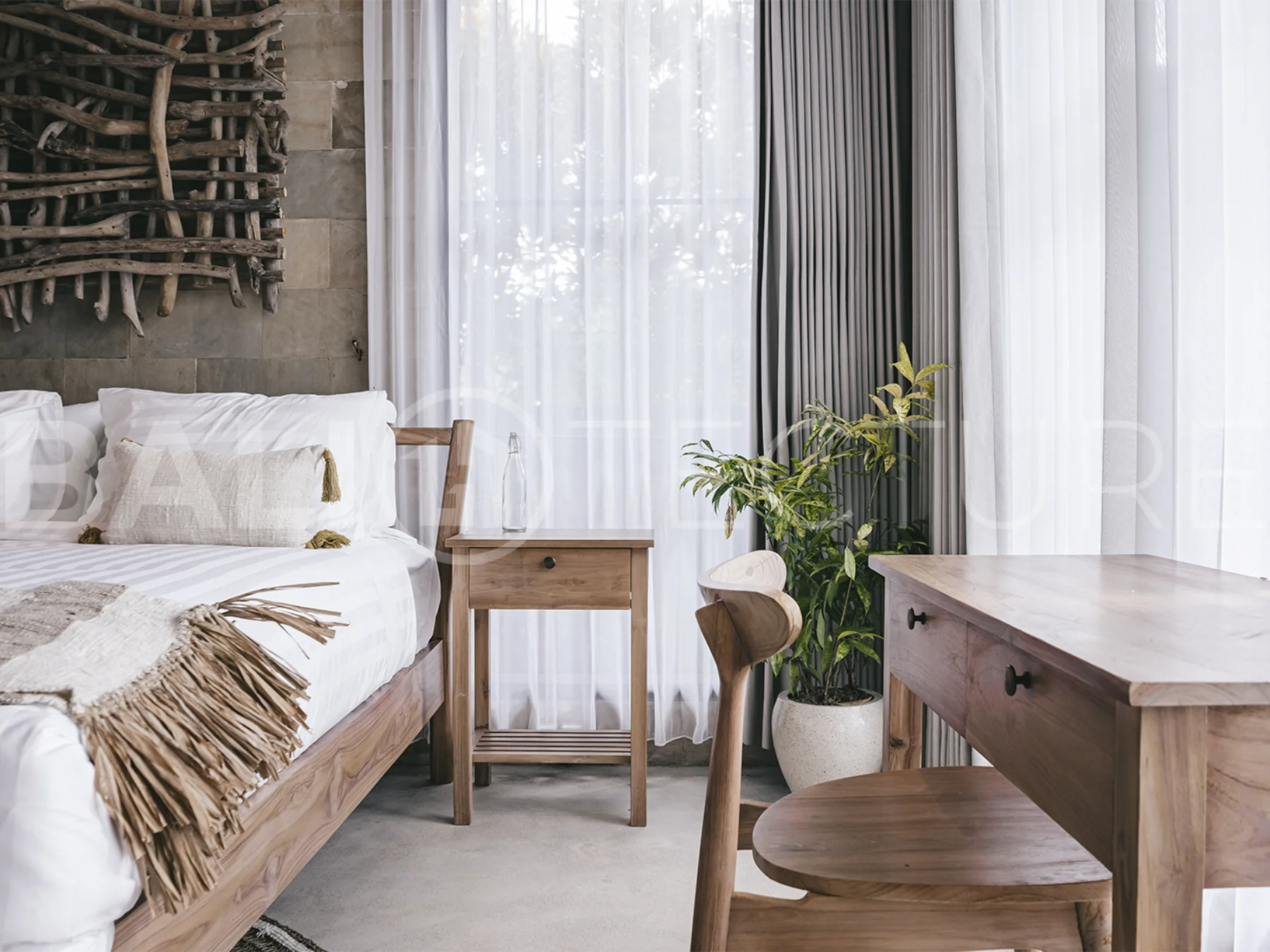 Elegant private pool surrounded by lush greenery in a tranquil Bali setting.