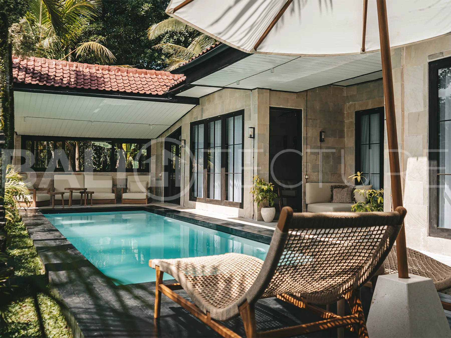 Comfortable bedroom with modern furnishings in a 4-bedroom Ubud villa.