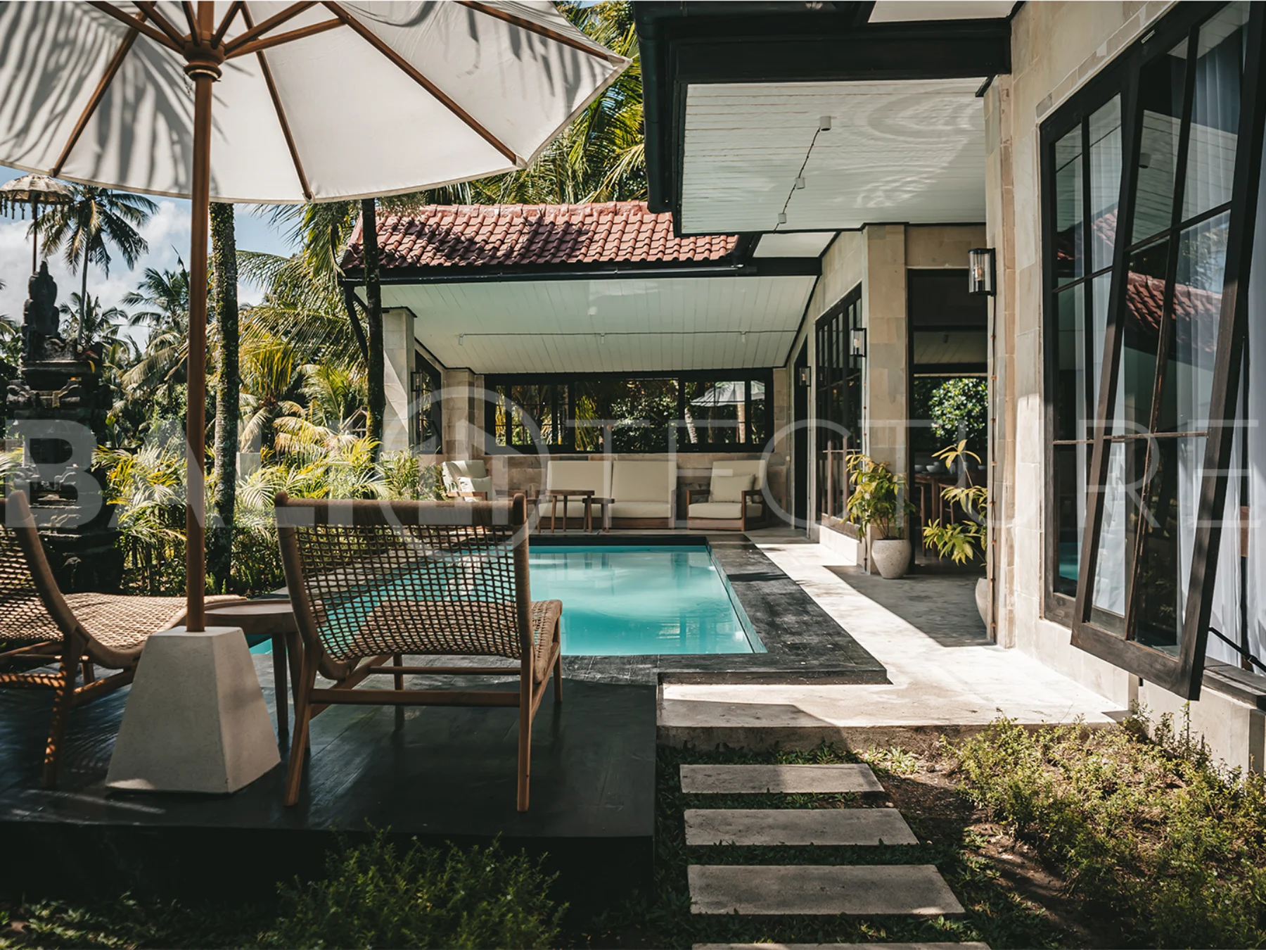 Comfortable bedroom with modern furnishings in a 4-bedroom Ubud villa.