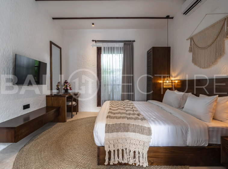 Modern villa with a private pool in Ubud, Bali, featuring sleek architecture and lush surroundings.