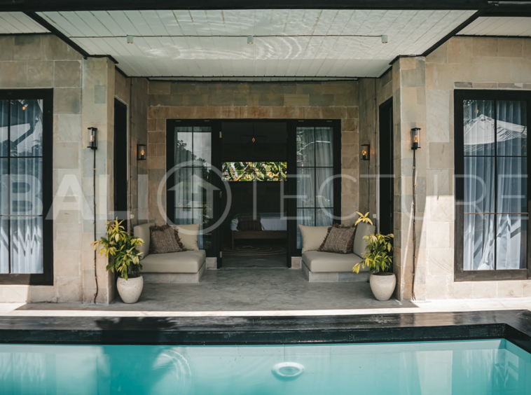 Comfortable bedroom with modern furnishings in a 4-bedroom Ubud villa.