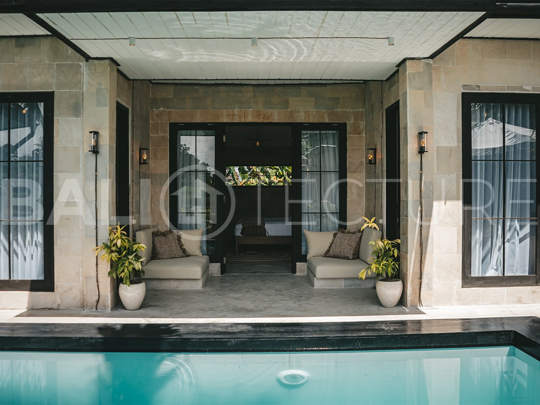 Comfortable bedroom with modern furnishings in a 4-bedroom Ubud villa.