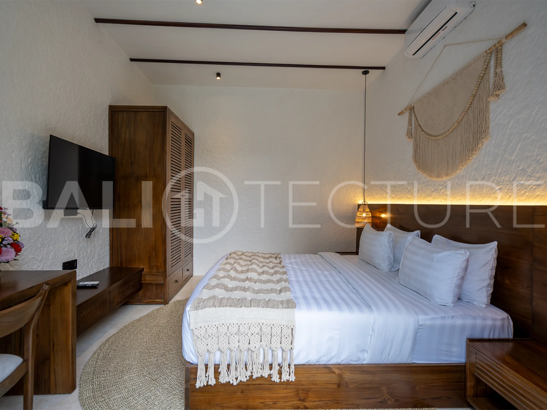 Modern villa with a private pool in Ubud, Bali, featuring sleek architecture and lush surroundings.