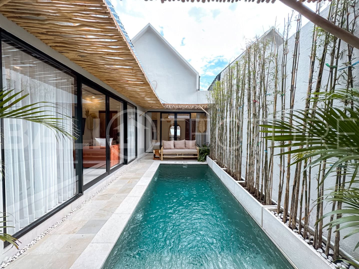 Modern 2-bedroom villa in Seminyak with private pool and open-plan living space.