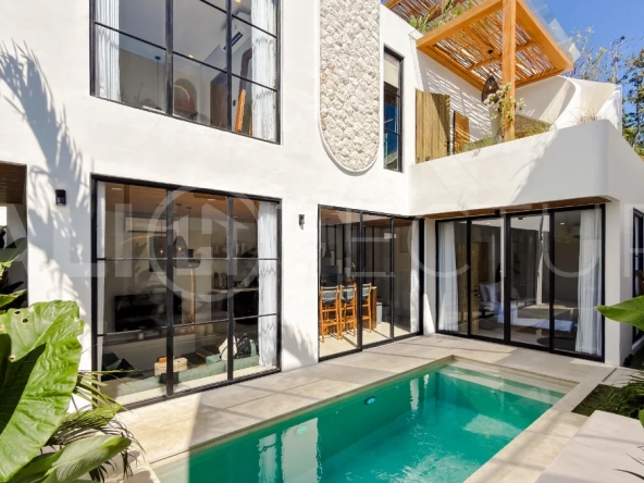 Modern tropical luxury villa at Solas Villas in Bingin, Bali, featuring contemporary architecture, stylish interiors, a private infinity pool, and a rooftop terrace with panoramic ocean views. Surrounded by lush tropical scenery, the villa offers a sophisticated coastal lifestyle with high-quality finishes and functional living spaces. Scheduled for completion in late 2025, this exclusive property is located in one of Bali's most desirable destinations and is eligible for buyer financing.