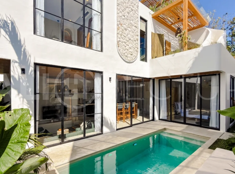 Modern tropical luxury villa at Solas Villas in Bingin, Bali, featuring contemporary architecture, stylish interiors, a private infinity pool, and a rooftop terrace with panoramic ocean views. Surrounded by lush tropical scenery, the villa offers a sophisticated coastal lifestyle with high-quality finishes and functional living spaces. Scheduled for completion in late 2025, this exclusive property is located in one of Bali's most desirable destinations and is eligible for buyer financing.