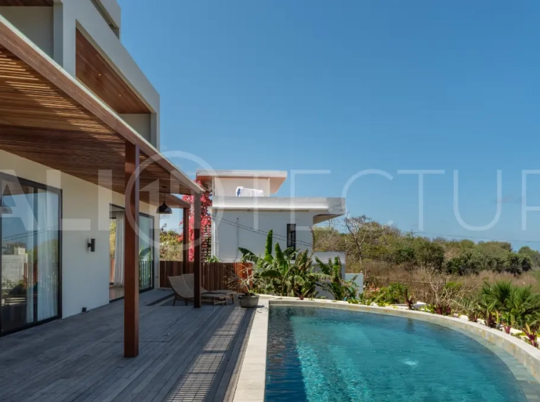 Luxury 3-bedroom ocean-view villa in Pecatu, Uluwatu, Bali, featuring a private pool, tropical Zen garden, rooftop terrace, modern interiors, and panoramic sunset views.