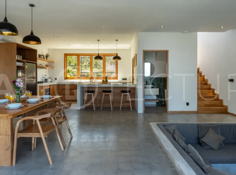 Luxury 3-bedroom ocean-view villa in Pecatu, Uluwatu, Bali, featuring a private pool, tropical Zen garden, rooftop terrace, modern interiors, and panoramic sunset views.