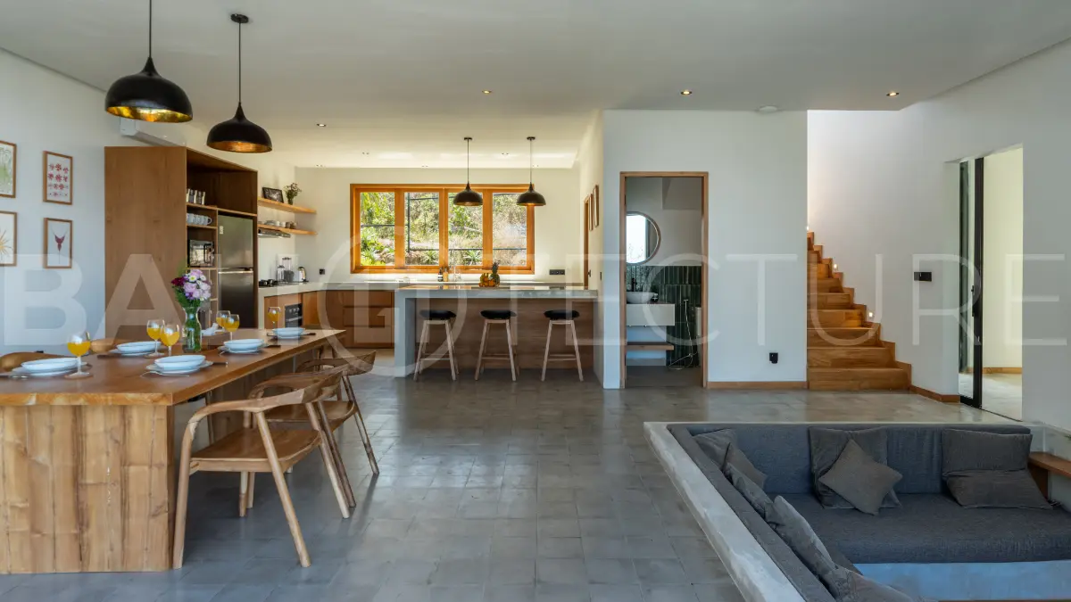 Luxury 3-bedroom ocean-view villa in Pecatu, Uluwatu, Bali, featuring a private pool, tropical Zen garden, rooftop terrace, modern interiors, and panoramic sunset views.