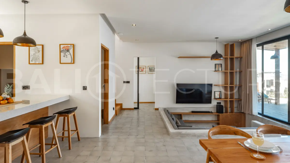 Luxury 3-bedroom ocean-view villa in Pecatu, Uluwatu, Bali, featuring a private pool, tropical Zen garden, rooftop terrace, modern interiors, and panoramic sunset views.