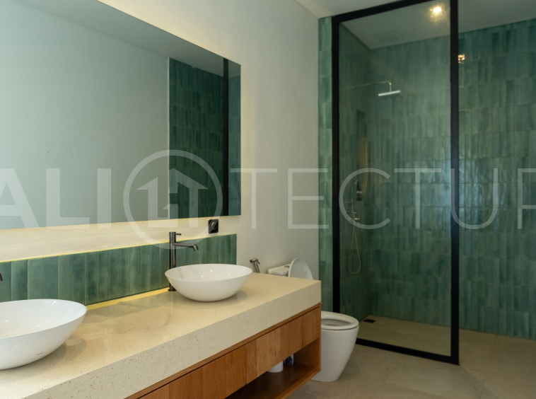 Luxury 3-bedroom ocean-view villa in Pecatu, Uluwatu, Bali, featuring a private pool, tropical Zen garden, rooftop terrace, modern interiors, and panoramic sunset views.