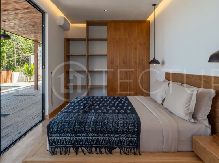Luxury 3-bedroom ocean-view villa in Pecatu, Uluwatu, Bali, featuring a private pool, tropical Zen garden, rooftop terrace, modern interiors, and panoramic sunset views.