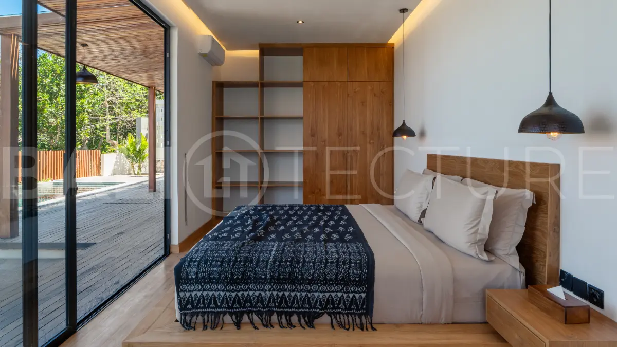 Luxury 3-bedroom ocean-view villa in Pecatu, Uluwatu, Bali, featuring a private pool, tropical Zen garden, rooftop terrace, modern interiors, and panoramic sunset views.