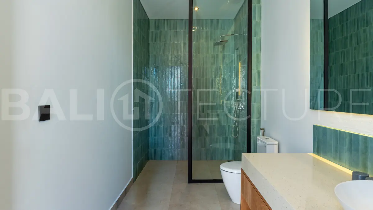Luxury 3-bedroom ocean-view villa in Pecatu, Uluwatu, Bali, featuring a private pool, tropical Zen garden, rooftop terrace, modern interiors, and panoramic sunset views.