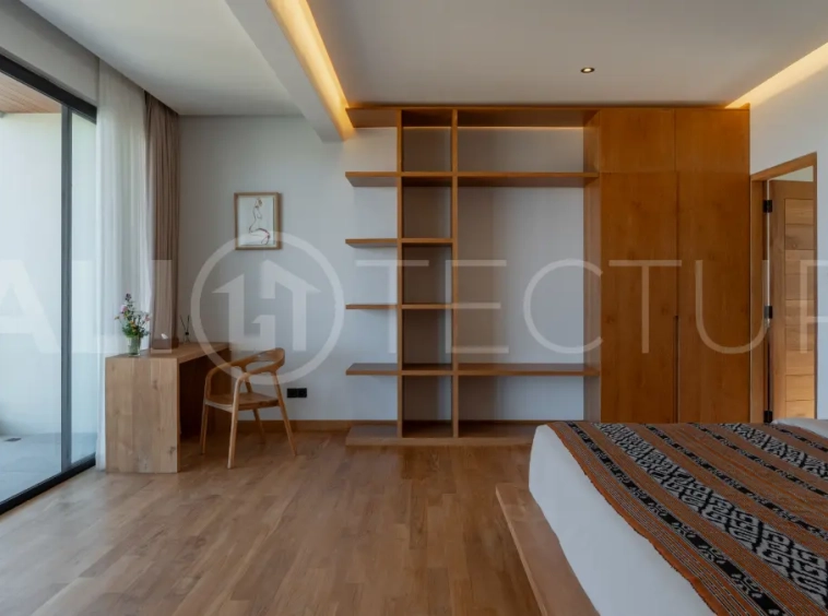 Luxury 3-bedroom ocean-view villa in Pecatu, Uluwatu, Bali, featuring a private pool, tropical Zen garden, rooftop terrace, modern interiors, and panoramic sunset views.
