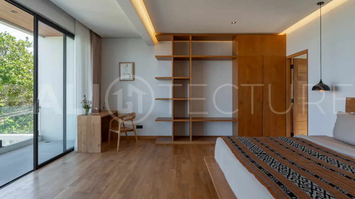 Luxury 3-bedroom ocean-view villa in Pecatu, Uluwatu, Bali, featuring a private pool, tropical Zen garden, rooftop terrace, modern interiors, and panoramic sunset views.