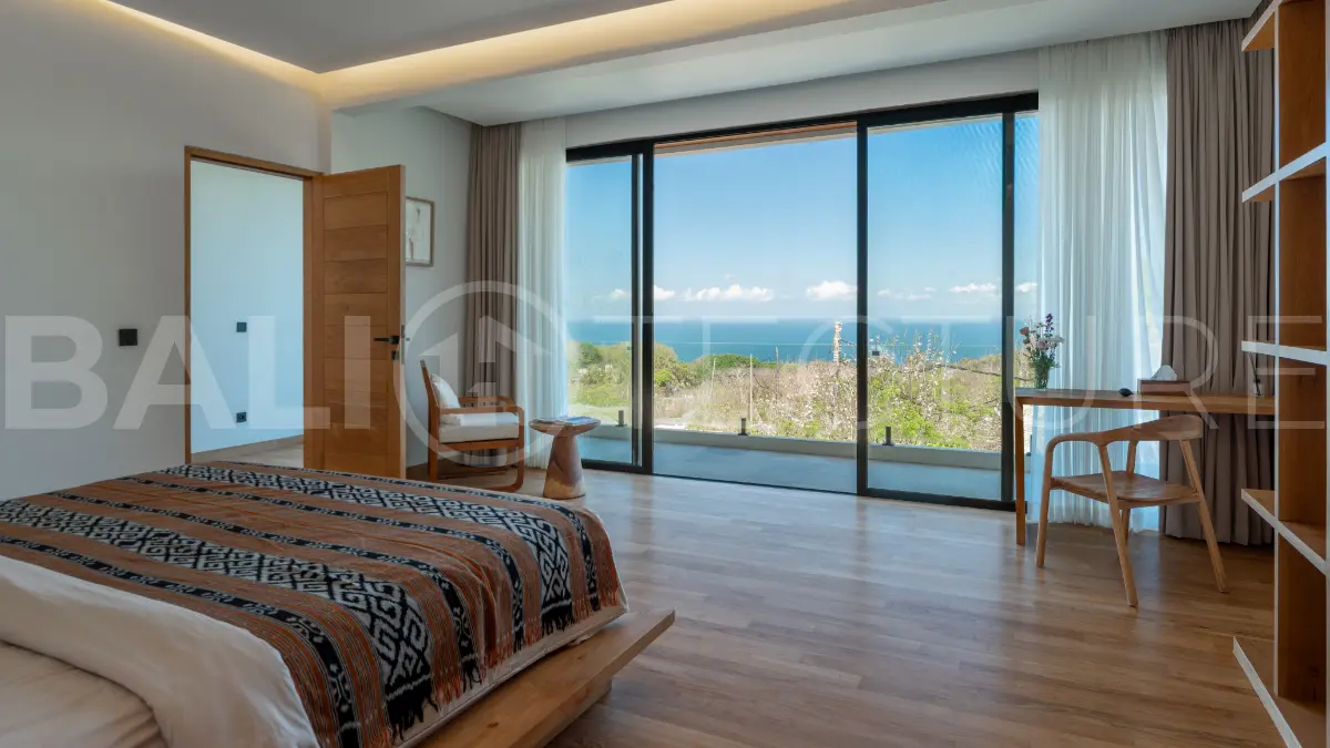 Luxury 3-bedroom ocean-view villa in Pecatu, Uluwatu, Bali, featuring a private pool, tropical Zen garden, rooftop terrace, modern interiors, and panoramic sunset views.