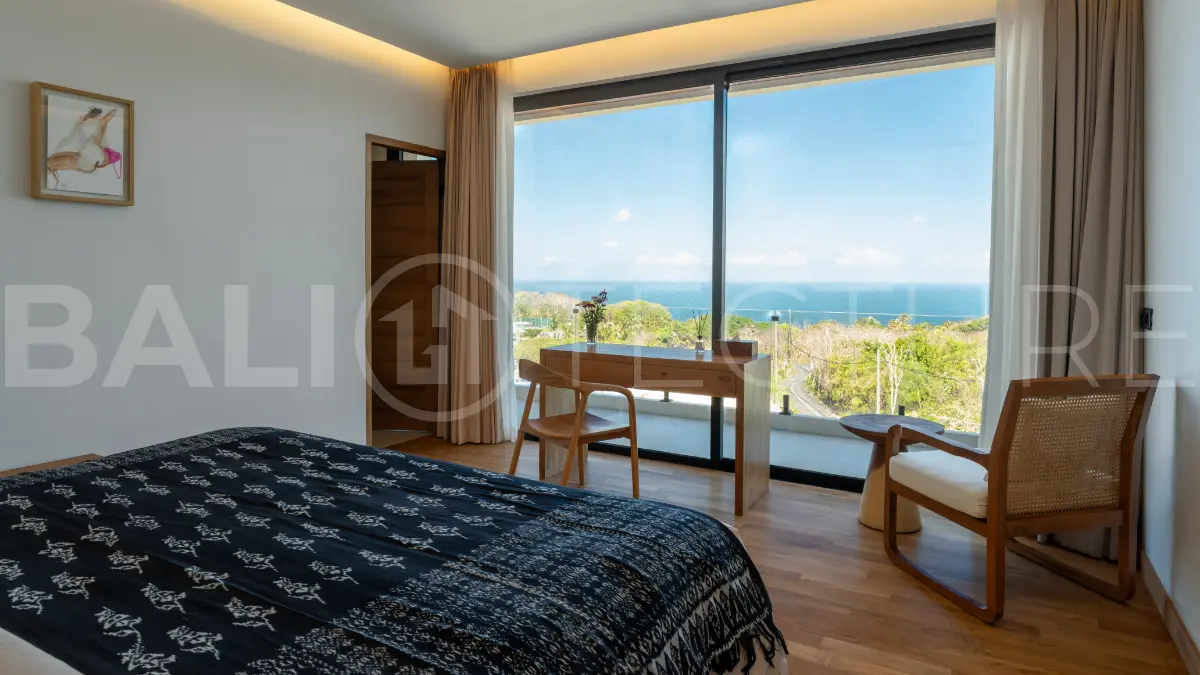 Luxury 3-bedroom ocean-view villa in Pecatu, Uluwatu, Bali, featuring a private pool, tropical Zen garden, rooftop terrace, modern interiors, and panoramic sunset views.