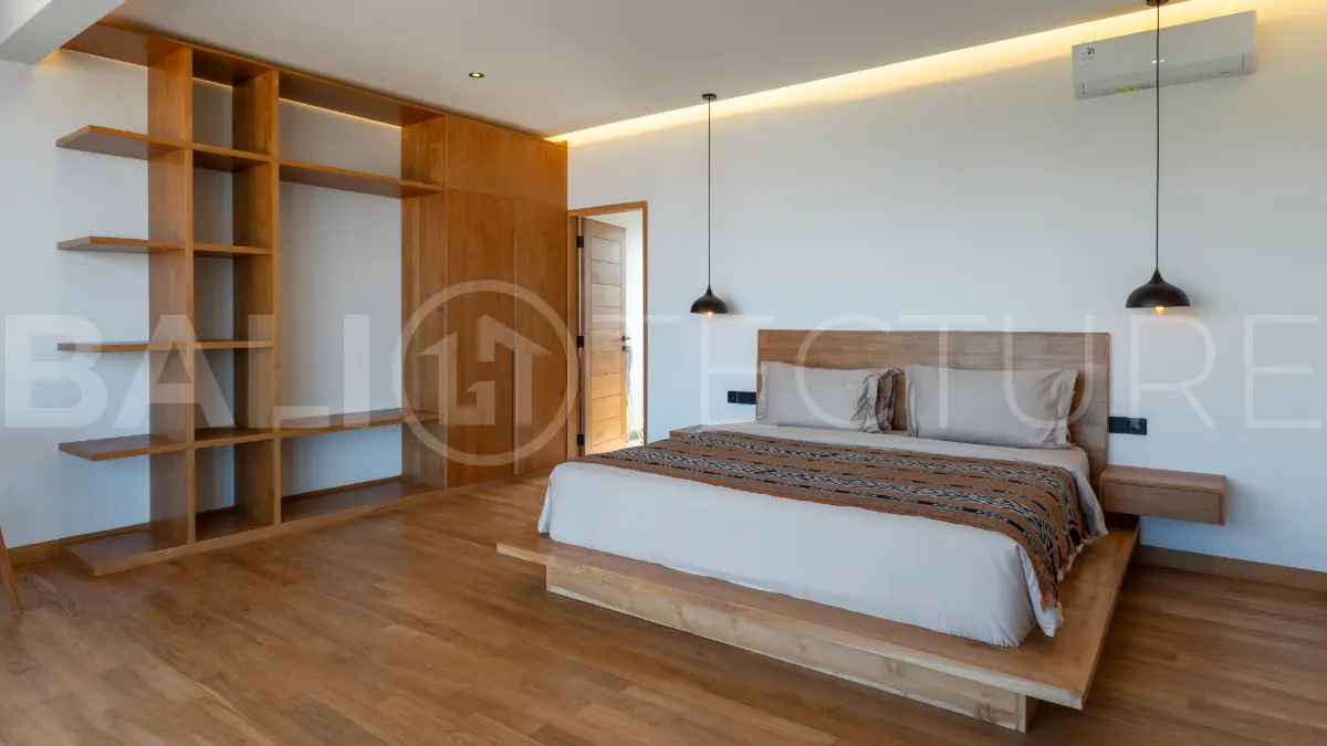 Luxury 3-bedroom ocean-view villa in Pecatu, Uluwatu, Bali, featuring a private pool, tropical Zen garden, rooftop terrace, modern interiors, and panoramic sunset views.