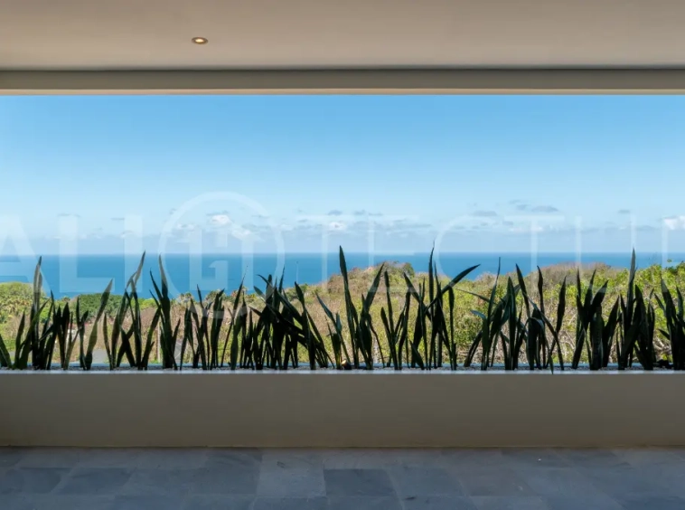Luxury 3-bedroom ocean-view villa in Pecatu, Uluwatu, Bali, featuring a private pool, tropical Zen garden, rooftop terrace, modern interiors, and panoramic sunset views.