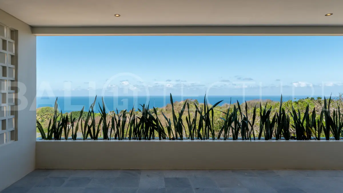 Luxury 3-bedroom ocean-view villa in Pecatu, Uluwatu, Bali, featuring a private pool, tropical Zen garden, rooftop terrace, modern interiors, and panoramic sunset views.
