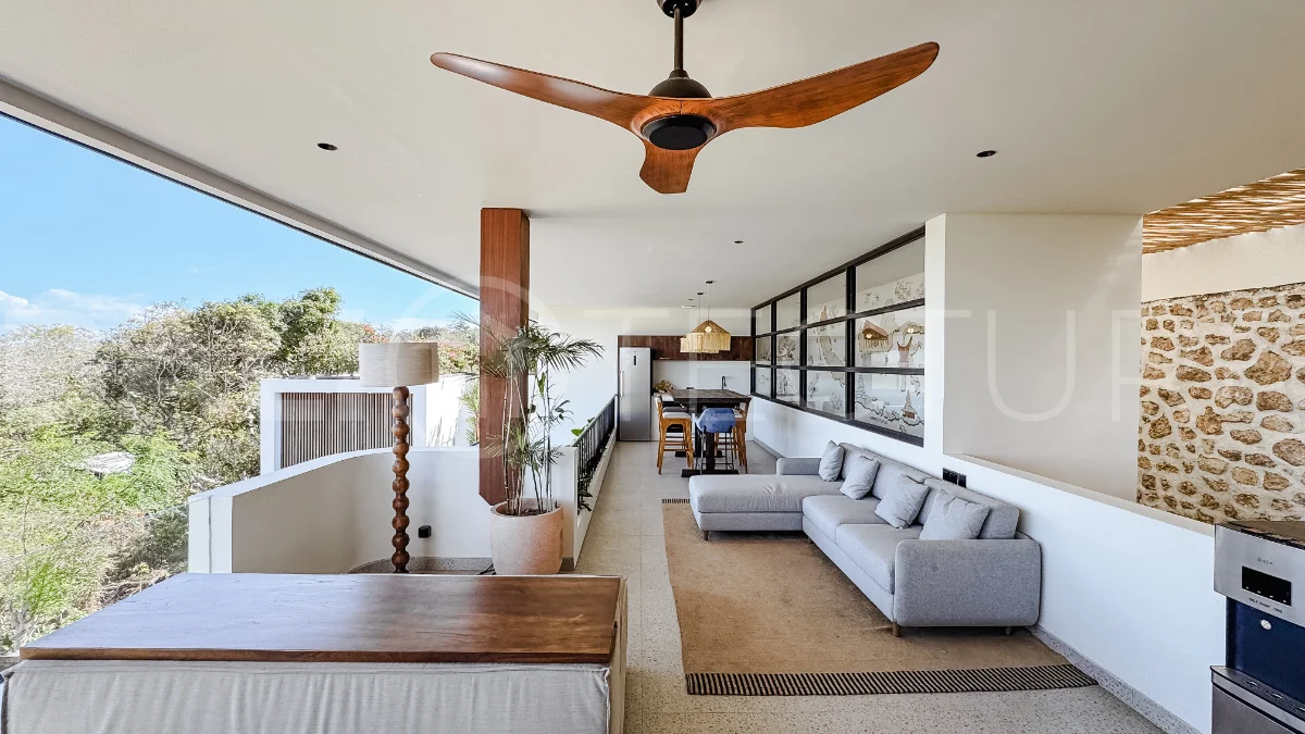 Brand new 3-bedroom tropical villa in Pecatu, Uluwatu featuring contemporary architecture, elegant natural finishes, and panoramic ocean views. The property includes three ensuite bedrooms, an enclosed living and dining area, a fully enclosed kitchen, a private 6 x 2 meter swimming pool, landscaped garden, balcony, and a rooftop terrace overlooking the ocean. Set on 204 m² of land with a 220 m² two-story building, the fully furnished villa is scheduled for completion in 2026 and is available under freehold and leasehold ownership in a prime tourism area.