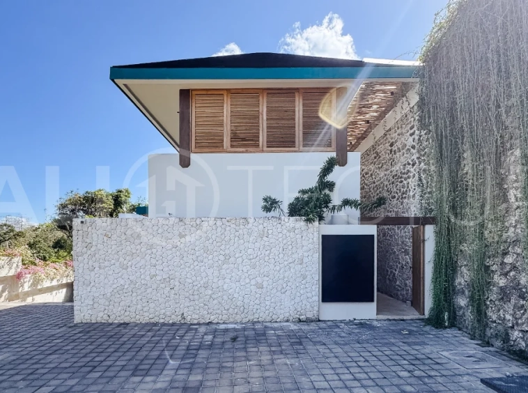 Brand new 3-bedroom tropical villa in Pecatu, Uluwatu featuring contemporary architecture, elegant natural finishes, and panoramic ocean views. The property includes three ensuite bedrooms, an enclosed living and dining area, a fully enclosed kitchen, a private 6 x 2 meter swimming pool, landscaped garden, balcony, and a rooftop terrace overlooking the ocean. Set on 204 m² of land with a 220 m² two-story building, the fully furnished villa is scheduled for completion in 2026 and is available under freehold and leasehold ownership in a prime tourism area.