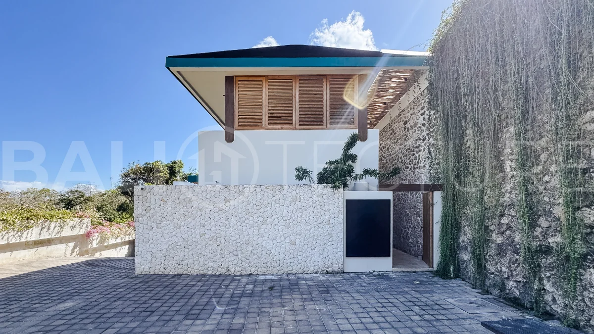 Brand new 3-bedroom tropical villa in Pecatu, Uluwatu featuring contemporary architecture, elegant natural finishes, and panoramic ocean views. The property includes three ensuite bedrooms, an enclosed living and dining area, a fully enclosed kitchen, a private 6 x 2 meter swimming pool, landscaped garden, balcony, and a rooftop terrace overlooking the ocean. Set on 204 m² of land with a 220 m² two-story building, the fully furnished villa is scheduled for completion in 2026 and is available under freehold and leasehold ownership in a prime tourism area.