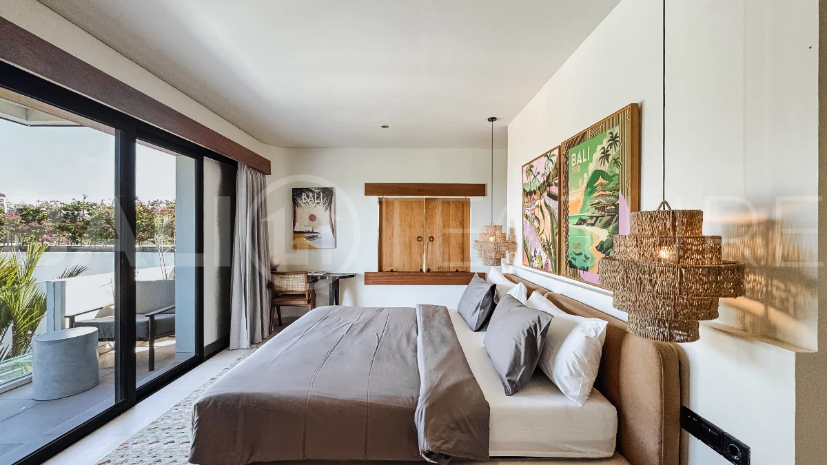 Brand new 3-bedroom tropical villa in Pecatu, Uluwatu featuring contemporary architecture, elegant natural finishes, and panoramic ocean views. The property includes three ensuite bedrooms, an enclosed living and dining area, a fully enclosed kitchen, a private 6 x 2 meter swimming pool, landscaped garden, balcony, and a rooftop terrace overlooking the ocean. Set on 204 m² of land with a 220 m² two-story building, the fully furnished villa is scheduled for completion in 2026 and is available under freehold and leasehold ownership in a prime tourism area.