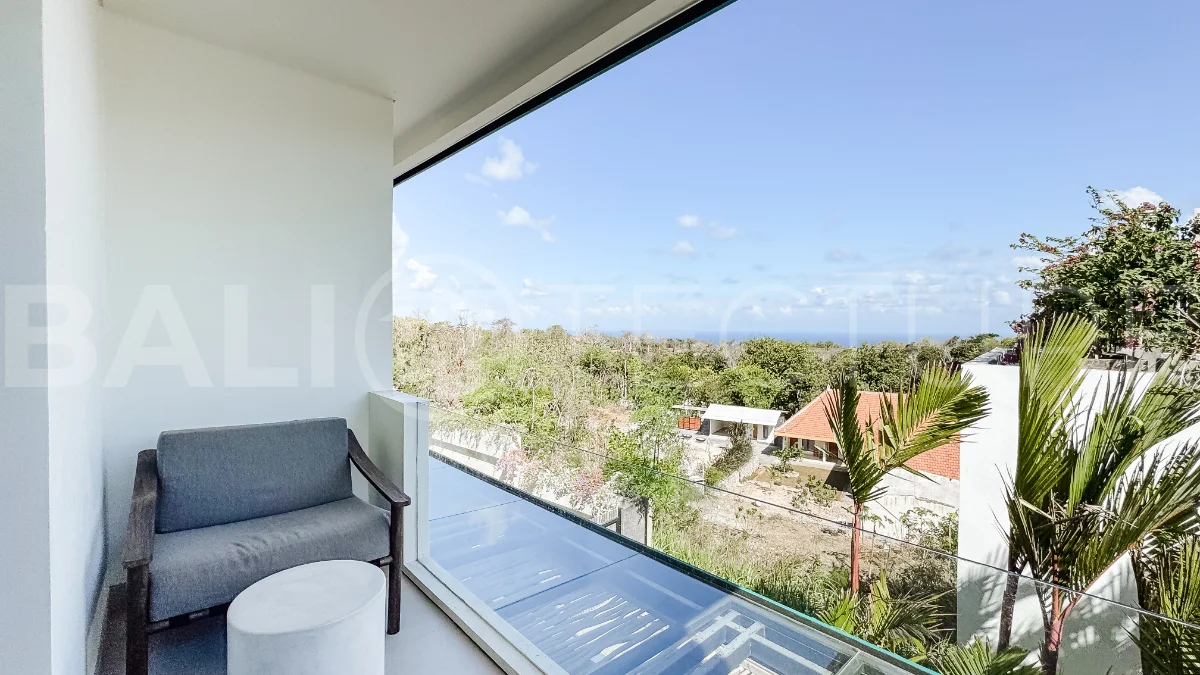 Brand new 3-bedroom tropical villa in Pecatu, Uluwatu featuring contemporary architecture, elegant natural finishes, and panoramic ocean views. The property includes three ensuite bedrooms, an enclosed living and dining area, a fully enclosed kitchen, a private 6 x 2 meter swimming pool, landscaped garden, balcony, and a rooftop terrace overlooking the ocean. Set on 204 m² of land with a 220 m² two-story building, the fully furnished villa is scheduled for completion in 2026 and is available under freehold and leasehold ownership in a prime tourism area.