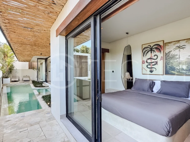 Brand new 3-bedroom tropical villa in Pecatu, Uluwatu featuring contemporary architecture, elegant natural finishes, and panoramic ocean views. The property includes three ensuite bedrooms, an enclosed living and dining area, a fully enclosed kitchen, a private 6 x 2 meter swimming pool, landscaped garden, balcony, and a rooftop terrace overlooking the ocean. Set on 204 m² of land with a 220 m² two-story building, the fully furnished villa is scheduled for completion in 2026 and is available under freehold and leasehold ownership in a prime tourism area.