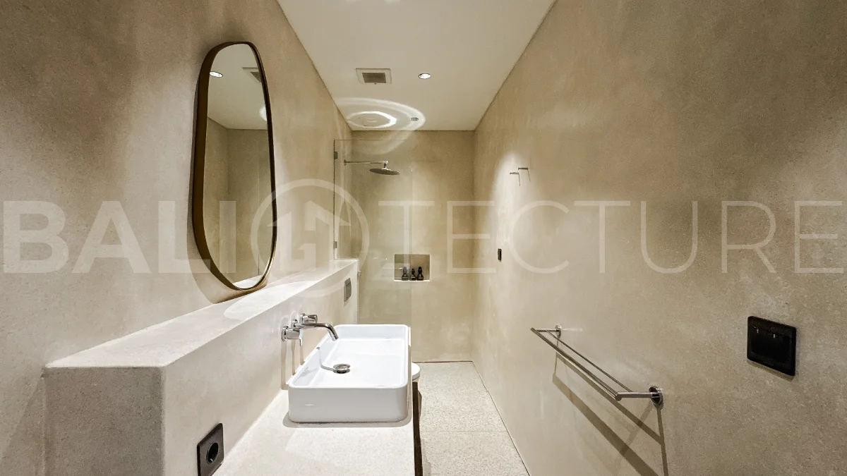 Brand new 3-bedroom tropical villa in Pecatu, Uluwatu featuring contemporary architecture, elegant natural finishes, and panoramic ocean views. The property includes three ensuite bedrooms, an enclosed living and dining area, a fully enclosed kitchen, a private 6 x 2 meter swimming pool, landscaped garden, balcony, and a rooftop terrace overlooking the ocean. Set on 204 m² of land with a 220 m² two-story building, the fully furnished villa is scheduled for completion in 2026 and is available under freehold and leasehold ownership in a prime tourism area.