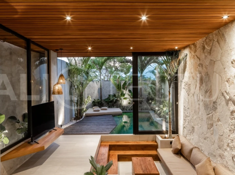 Off-plan 2-bedroom villa for sale near Bingin Beach, featuring traditional Balinese and contemporary architecture, a private 10 m² swimming pool, lush tropical surroundings, and fully furnished interiors.