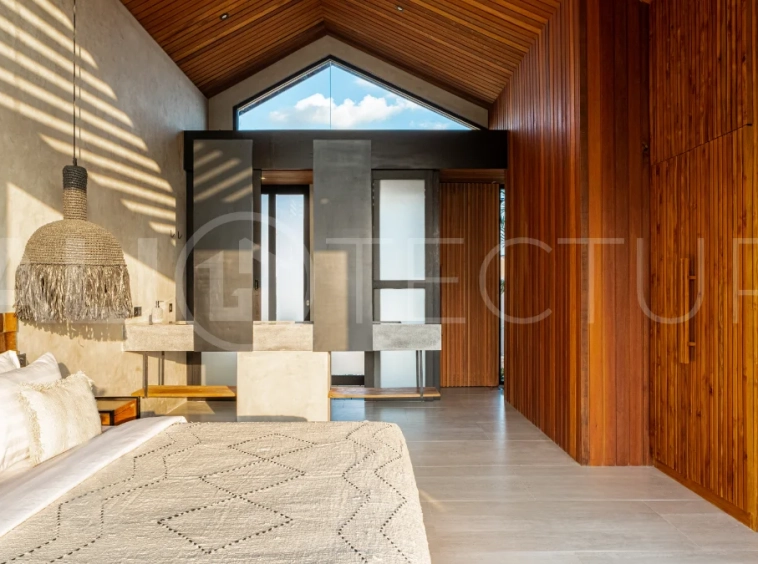 Off-plan 2-bedroom villa for sale near Bingin Beach, featuring traditional Balinese and contemporary architecture, a private 10 m² swimming pool, lush tropical surroundings, and fully furnished interiors.