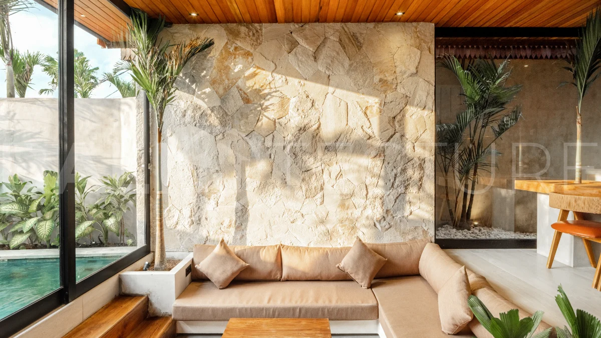 Off-plan 2-bedroom villa for sale near Bingin Beach, featuring traditional Balinese and contemporary architecture, a private 10 m² swimming pool, lush tropical surroundings, and fully furnished interiors.