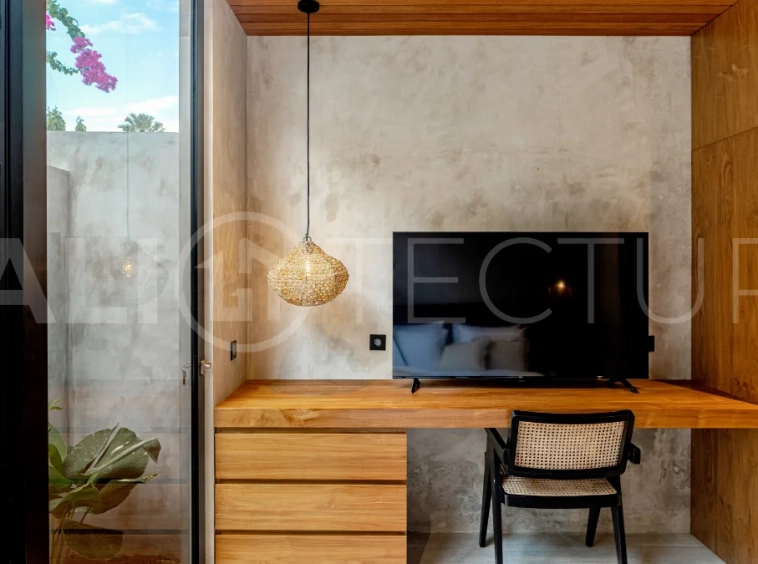 Off-plan 2-bedroom villa for sale near Bingin Beach, featuring traditional Balinese and contemporary architecture, a private 10 m² swimming pool, lush tropical surroundings, and fully furnished interiors.