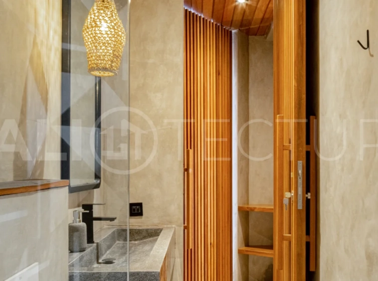 Off-plan 2-bedroom villa for sale near Bingin Beach, featuring traditional Balinese and contemporary architecture, a private 10 m² swimming pool, lush tropical surroundings, and fully furnished interiors.