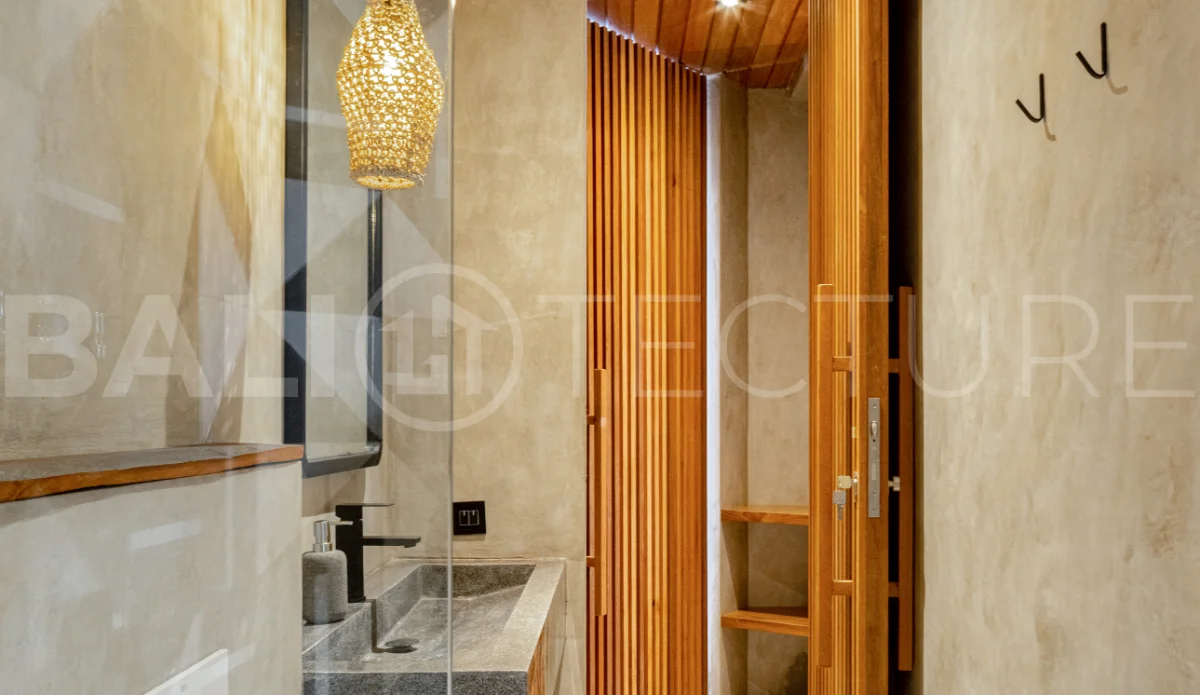 Off-plan 2-bedroom villa for sale near Bingin Beach, featuring traditional Balinese and contemporary architecture, a private 10 m² swimming pool, lush tropical surroundings, and fully furnished interiors.