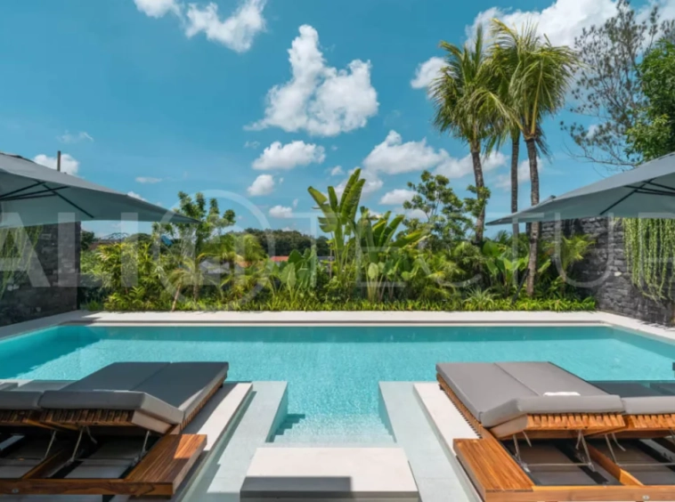 Luxury four bedroom leasehold villa in Canggu, Bali, featuring a private garden, 45sqm swimming pool, spacious living area, modern kitchen, outdoor terrace, jacuzzi, and premium entertainment amenities.