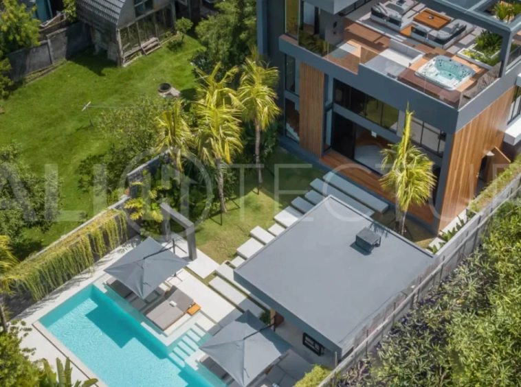 Luxury four bedroom leasehold villa in Canggu, Bali, featuring a private garden, 45sqm swimming pool, spacious living area, modern kitchen, outdoor terrace, jacuzzi, and premium entertainment amenities.