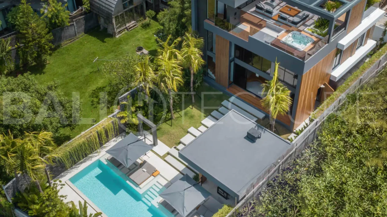 Luxury four bedroom leasehold villa in Canggu, Bali, featuring a private garden, 45sqm swimming pool, spacious living area, modern kitchen, outdoor terrace, jacuzzi, and premium entertainment amenities.