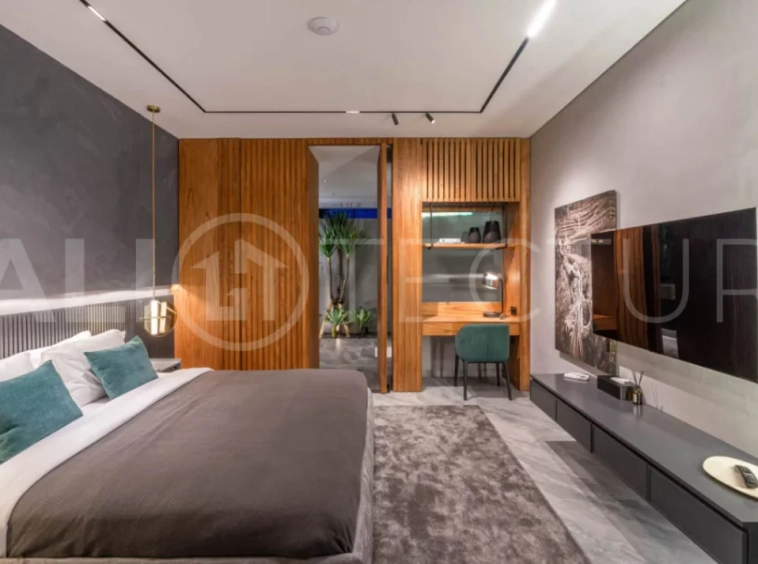 Luxury four bedroom leasehold villa in Canggu, Bali, featuring a private garden, 45sqm swimming pool, spacious living area, modern kitchen, outdoor terrace, jacuzzi, and premium entertainment amenities.
